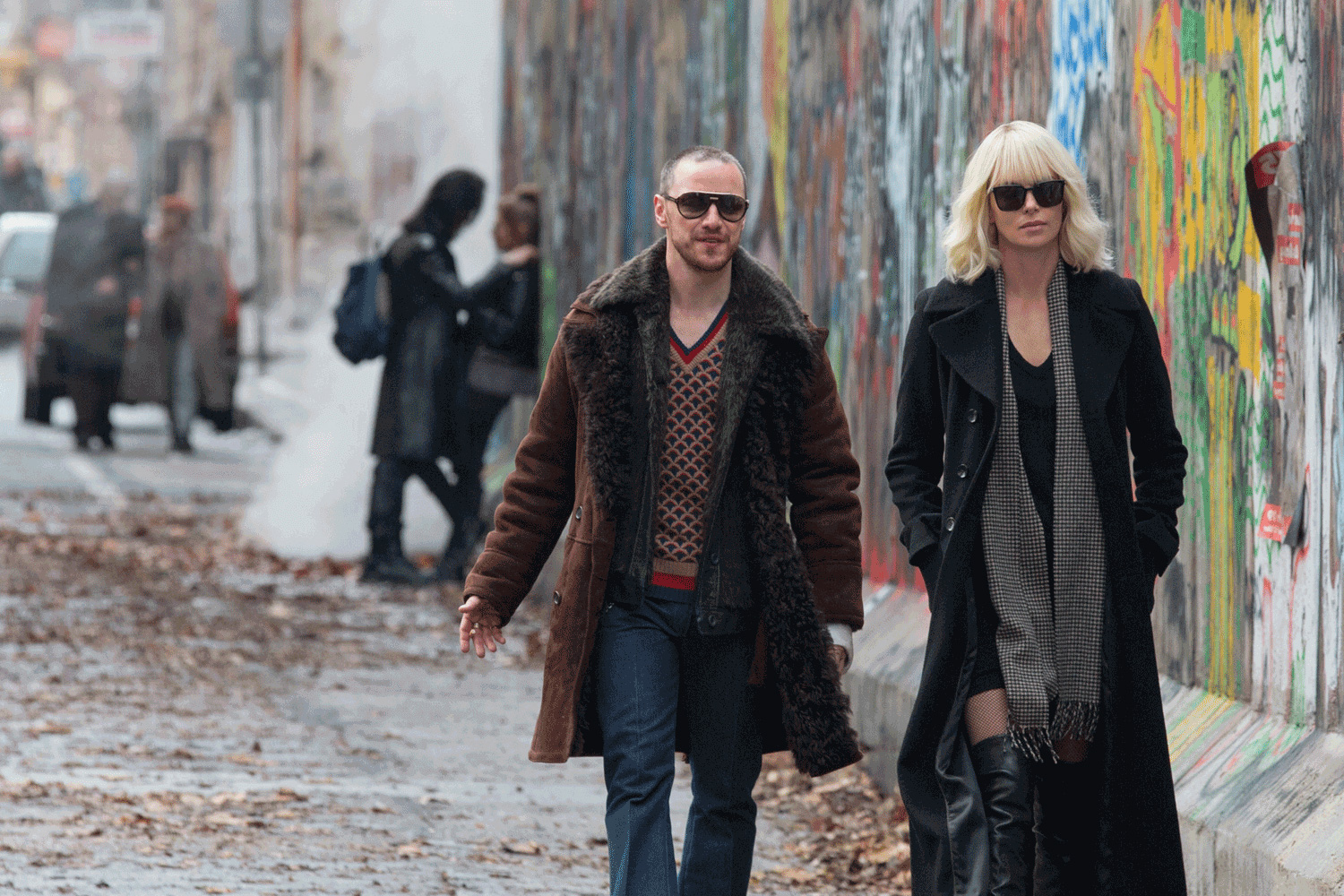 James McAvoy and Charlize Theron making freezing temperatures look sexy in Atomic Blonde. Image via .digitaltrends.com | Atomic Blonde movie review | onetakekate.com