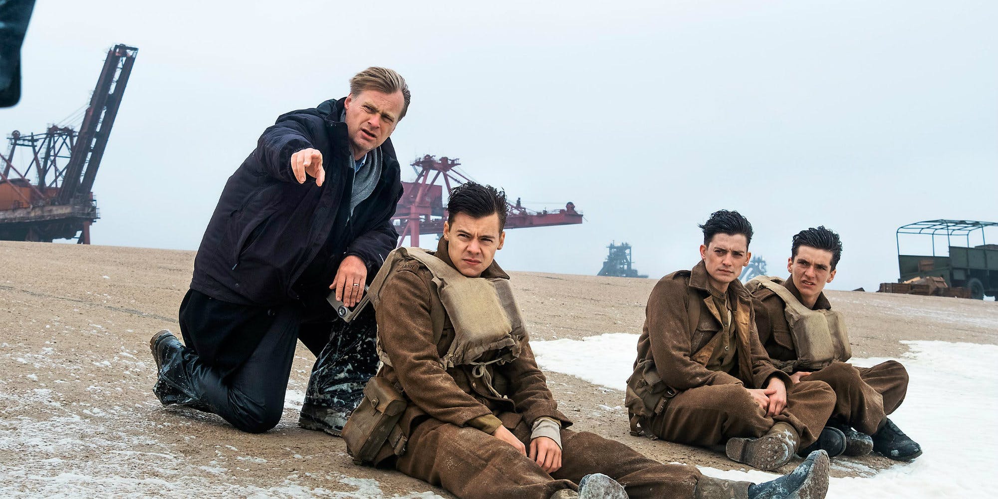 Christopher Nolan and Harry Styles on Dunkirk set. Image via Screen Rant | onetakekate.com
