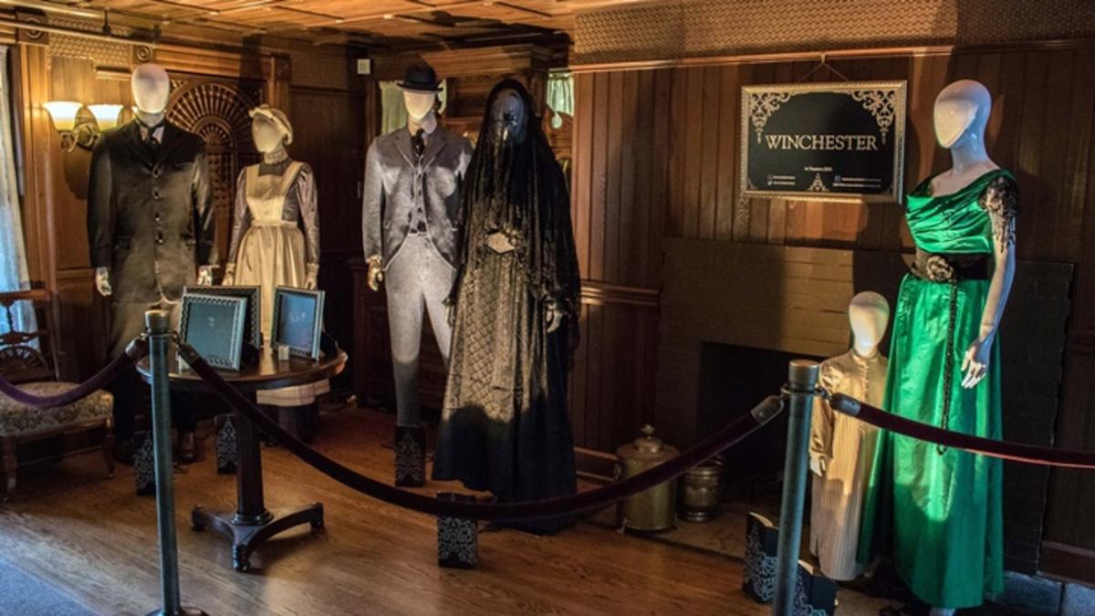 Costumes from Winchester set up at the real Winchester Mystery House...spooky AF. Image via NBC Bay Area | onetakekate.com
